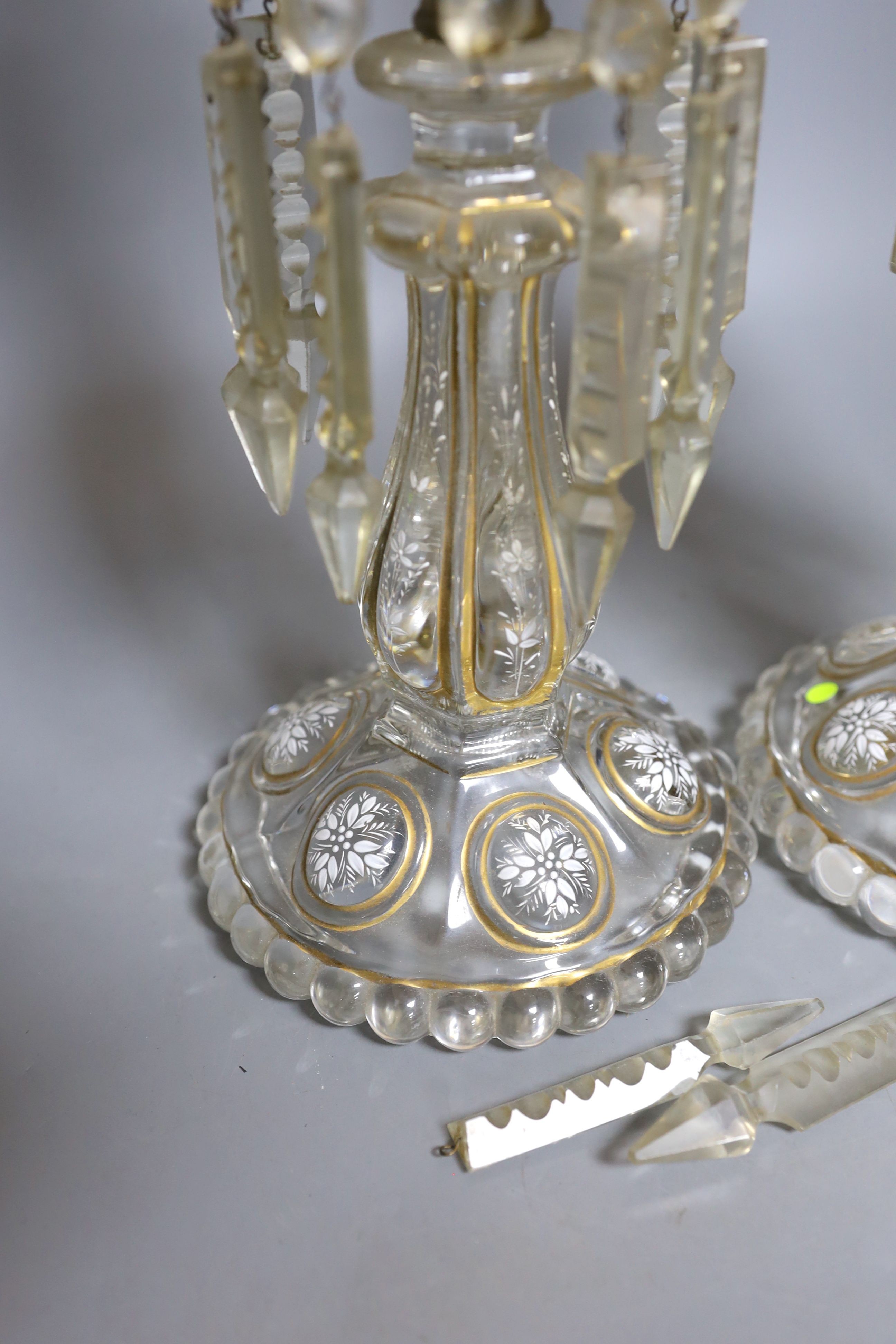 A pair of late 19th century French white-enamelled glass lustre hung storm lamps, 55cms high.